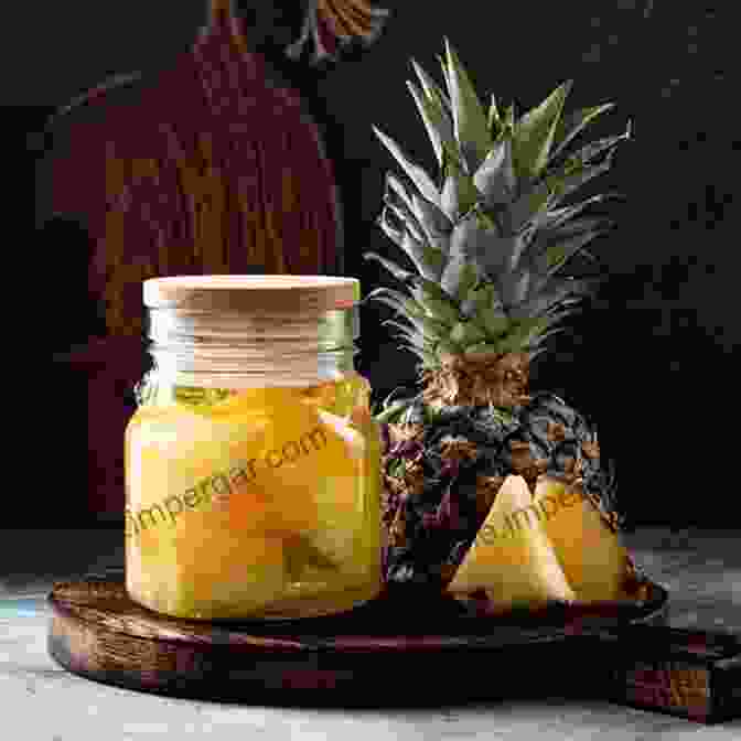 A Glass Showcasing The Golden Hued Pineapple Tepache, Adorned With A Pineapple Slice And Fresh Mint, Against A Vibrant Tropical Backdrop. Fermented Probiotic Drinks At Home: Make Your Own Kombucha Kefir Ginger Bug Jun Pineapple Tepache Honey Mead Beet Kvass And More