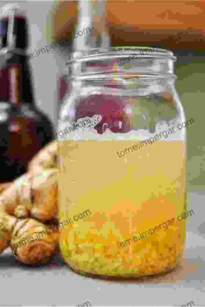 A Jar Filled With Homemade Ginger Bug, Featuring A Lively Effervescence Captured Against A Rustic Wooden Background. Fermented Probiotic Drinks At Home: Make Your Own Kombucha Kefir Ginger Bug Jun Pineapple Tepache Honey Mead Beet Kvass And More