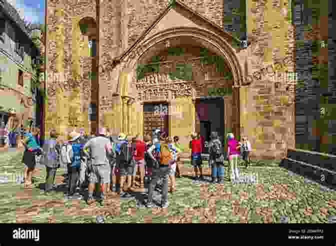 Pilgrims Walking Along The Via Podiensis, Passing By The Abbey Church Of St. Foy At Conques, Seeking Spiritual Guidance And Enrichment The Abbey Church Of St Foy At Conques: An Esoteric Perspective